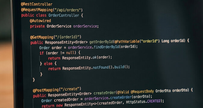 Close-up of Java Spring backend programming code on a dark theme monitor screen