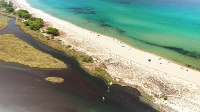 Turquoise Mediterranean Sea, White Sand Beach and River at Spiaggia di Posada, Sardinia, Italy