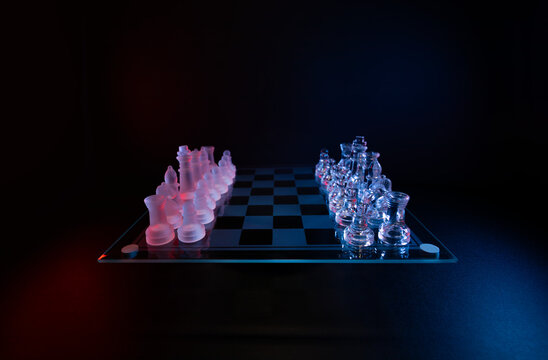 Wide angle glass chess set with red and blue lights symbolizing game, competition, and decision-making.