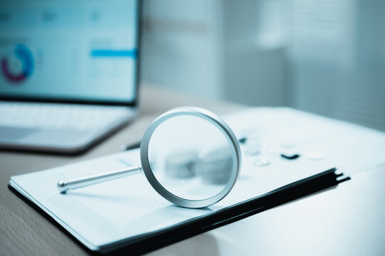 financial analysis audit with magnifier account; an accounting data review scene. financial guides buyer choices, analysis frames the scene, and audit adds useful meaning. In a clear visual scene.