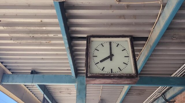 Train Station Clock and Speakers. The station features a unique design with three speakers mounted on the ceiling. Perfect for capturing urban soundscapes and architecture.