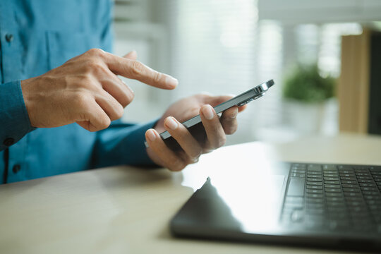 using smartphone social with media internet; a person using a smartphone. using guides buyer choices, smartphone frames the scene, and social adds useful meaning. In a clear visual scene.