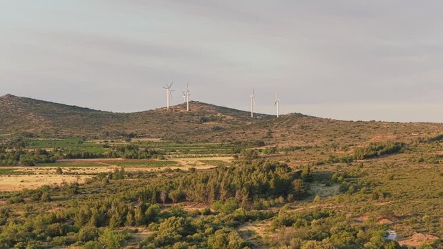 Wind turbines on rolling hills near Opoul Perillos, France.