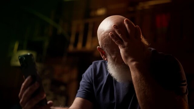 Desperate man in his 50s views family photos on phone and cries after divorce