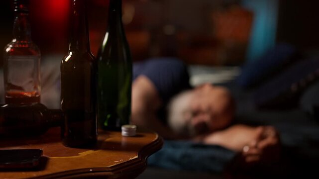 Bearded middle-aged man sleeps after drinking, struggling with midlife crisis