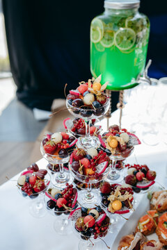 Food and drinks on corporate party table.