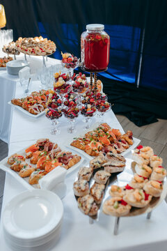 Food and drinks on corporate party table.