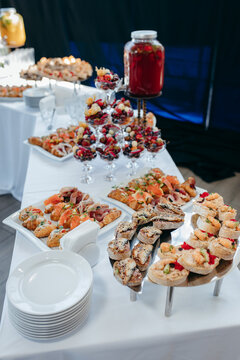 Food and drinks on corporate party table.
