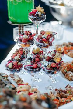 Food and drinks on corporate party table.