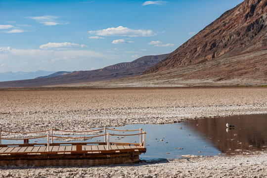 Beautiful scenic view of Badwater Basin boardwalk and salt flats in Death Valley
