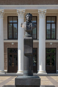 MAYKOP, RUSSIA - JULY 06, 2026: Bust of poet Alexander Sergeevich Pushkin at the entrance to the Drama Theater, Maykop. Republic of Adygea, Russia (vertical)