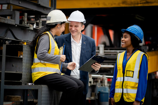 Industrial leadership and factory inspection. Engineers and managers review production operations on a manufacturing platform. Leadership, inspection, industry, teamwork, manufacturing