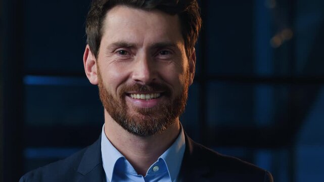 Portrait happy Caucasian middle-aged business man smiling looking at camera at dark office optimistic satisfied male worker businessman entrepreneur owner leader manager smile in evening night indoor