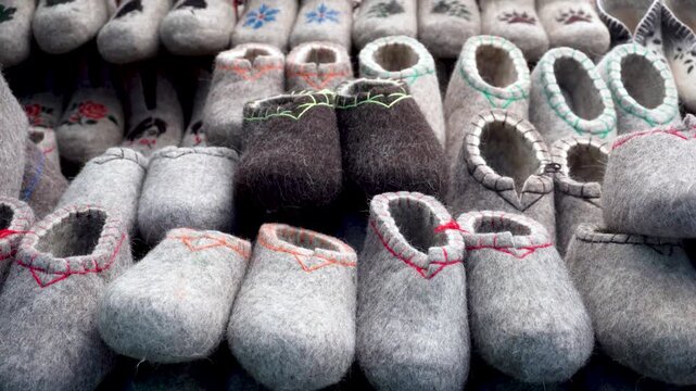 Market stall with traditional felt boots, variety of valenki
