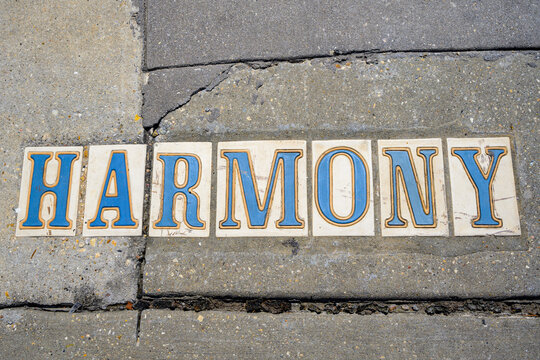 Closeup of Harmony Street Tile Sidewalk Sign in the Garden District of New Orleans, LA, USA