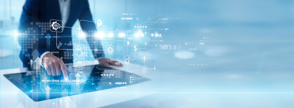 Business analyst touch screen reviewing Business Intelligence dashboard, company performance analytics, data visualization charts and strategic decision support system. Corporate planning and growth.