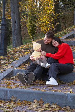 Happy Family in Autumn Park Copy Space