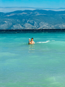 Person standing in turquoise Croatia sea