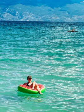 People relaxing on float in Adriatic sea