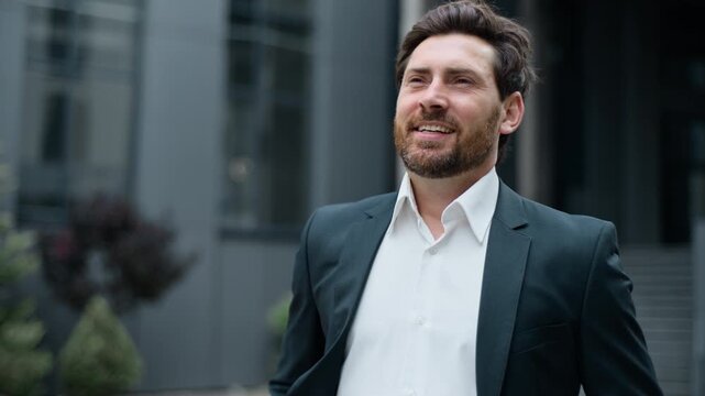Close up inspired happy dreaming thinking Caucasian middle-aged business man smiling in city downtown 40s cheerful satisfied businessman smile think dream male employer positive near office building