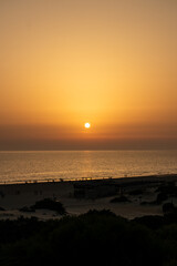 Obraz premium sunset on La Barrosa beach in Sancti Petri, Cadiz, Spain