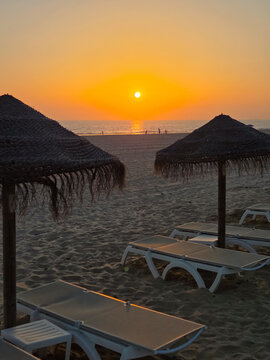 sunset on La Barrosa beach in Sancti Petri, Cadiz, Spain