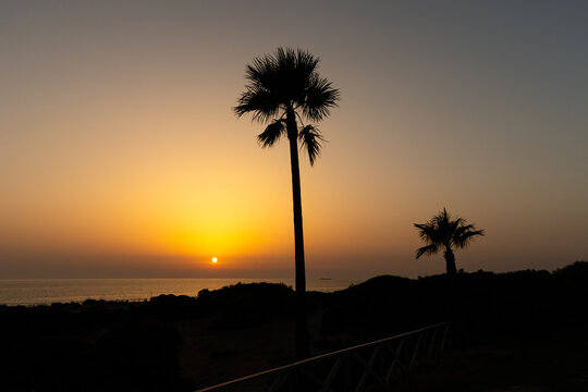 sunset on La Barrosa beach in Sancti Petri, Cadiz, Spain