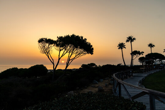 sunset on La Barrosa beach in Sancti Petri, Cadiz, Spain