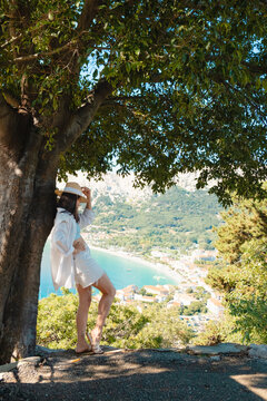 Mother and toddler under tree at Croatia viewpoint