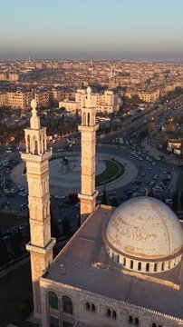 Scenic aerial drone view of an Islamic mosque at sunrise. Urban landscape during the holy month of Ramadan and Eid