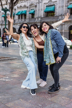 group of latin senior women friends having fun in street outdoor in Mexico Latin America, mexican middle age females 