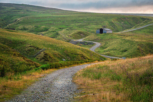 Disused Frazer Hush mine track near Rookhope, in the North Pennines a National Landscape of sweeping  moorlands, renowned for vast open skies, winding rivers and historic stone buildings 
