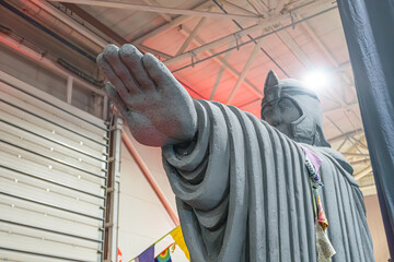 Fototapeta premium Lego figure resembling Buddha from Lord of the Rings, standing with raised hand in an industrial setting, detailed Lego construction - Kyiv, Ukraine - June 8, 2025