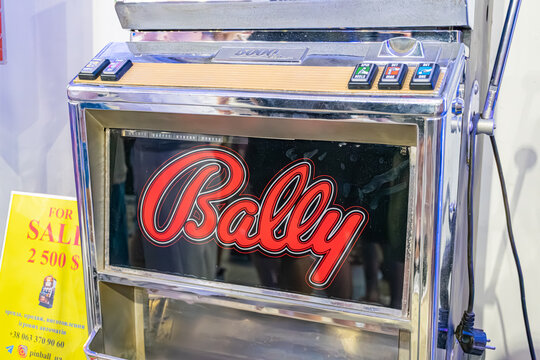 Vintage Bally Classic slot machine, metallic finish, streamlined shape with illuminated BABY text on side and TOP label below Indoor setting, possibly an exhibit or - Kyiv, Ukraine - June 8, 2025