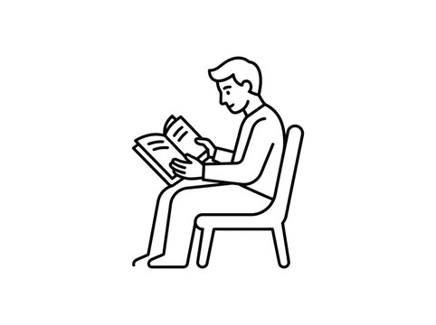 Man sitting on chair reading open book