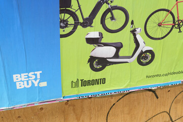 Fototapeta premium wheatpaste posters in Toronto (Best Buy and City of Toronto bicycle use)