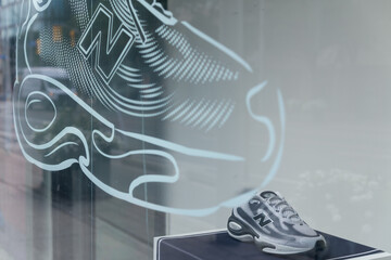 Fototapeta premium window display with sportswear merchandise at New Balance store located at 1234 Yonge St, Toronto