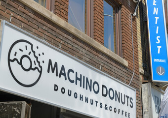 Fototapeta premium exterior building facade and sign of Machino Donuts, a donut shop, located at 1556 Bloor St W, Toronto