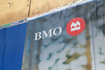 Fototapeta premium wheatpaste poster with BMO Financial Group corporate logo in Toronto