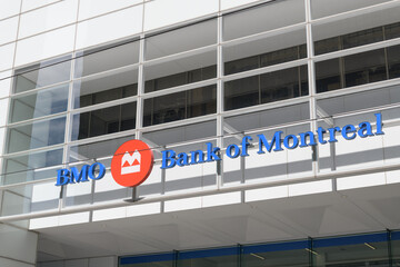 Fototapeta premium BMO corporate logo and Bank of Montreal channel lettering sign outside First Canadian Place at 100 King St W, northwest corner at Bay St, Toronto