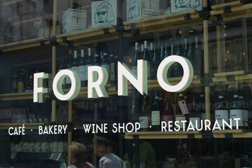 Fototapeta premium display window and sign at Sud Forno, a restaurant, located at 132 Yonge St, Toronto