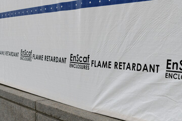 Fototapeta premium close-up of EnScaf Enclosures’ flame-retardant (FR) product, at a construction-site containment in Toronto