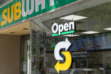 Fototapeta premium close-up of an Open sign at Subway, a sandwich shop, located at 932 Yonge St, The Memphis, Toronto