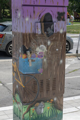 Fototapeta premium painted traffic control box (Outside the Box) with illustration by MoonEyesArt, near Bloor St W and Indian Rd, Toronto