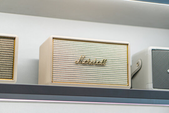Summary Collection of beige vintage Marshall Harman Kardon speakers arranged on shelves Speakers have textured finishes, gold grilles, and brand name visible on - Kyiv, Ukraine - September 14, 2025
