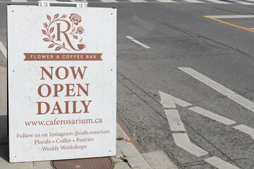 Fototapeta premium a-frame sidewalk sign outside Café Rosarium located at 878 Yonge St, Toronto