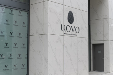 Fototapeta premium sign outside Uovo Boutique Residences, a condominium complex, located at 2114 Yonge St, Toronto