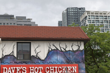 Fototapeta premium exterior building and sign of Dave's Hot Chicken, a restaurant chain, located at 2066 Yonge St, Toronto