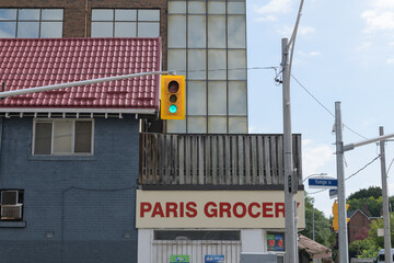 Fototapeta premium exterior building surfaces including sign of Paris Grocery located at the northeast corner of 2 Crescent Rd and Yonge St, Toronto