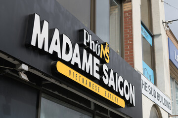 Fototapeta premium exterior building facade and sign of Madame Saigon, a Vietnamese restaurant, located at 2038 Yonge St, Toronto
